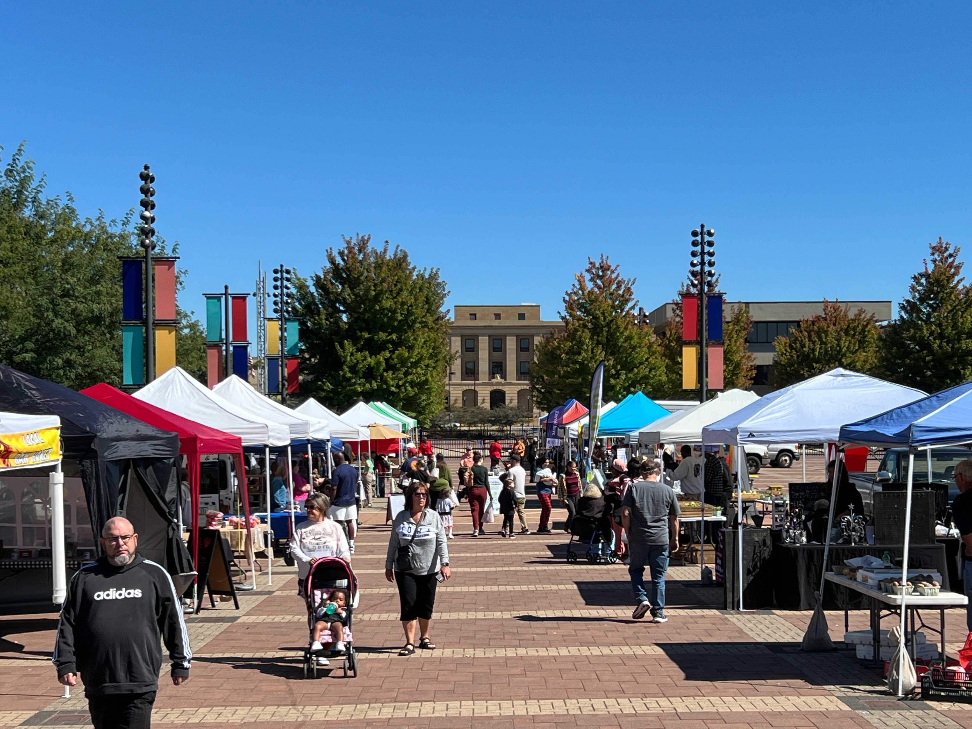 Image of community members shopping at the Waterloo Urban Farmers Market in downtown Waterloo.