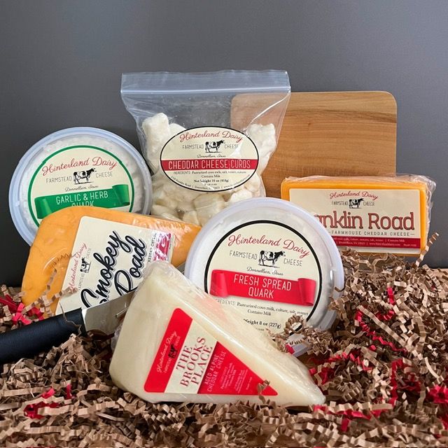 5 different kinds of Cheese from Hinterland Dairy are pictured as part of their Cheese Lovers Gift Box.