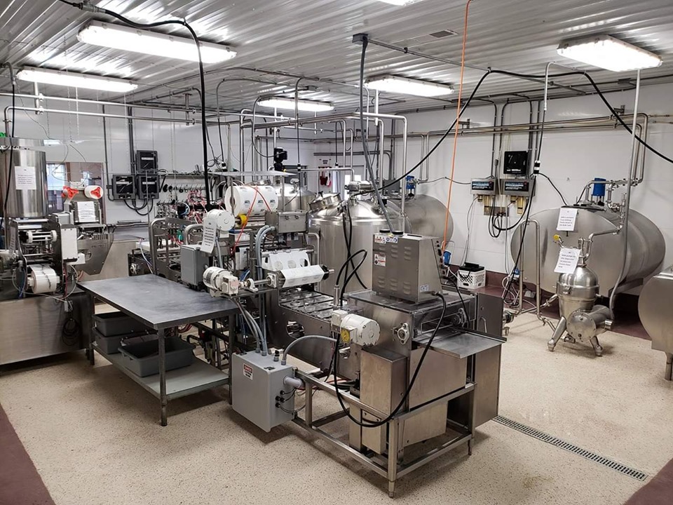 A production room filled with yogurt making equipment.