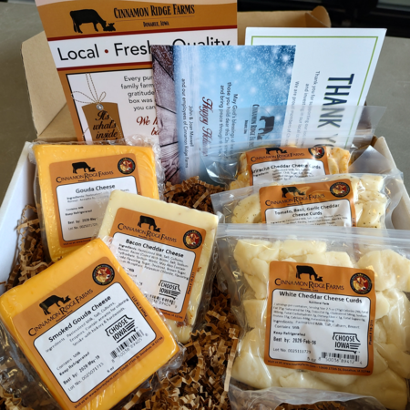 Cinnamon Ridge Farms gouda and cheese curds are display in a gift box available for purchase.