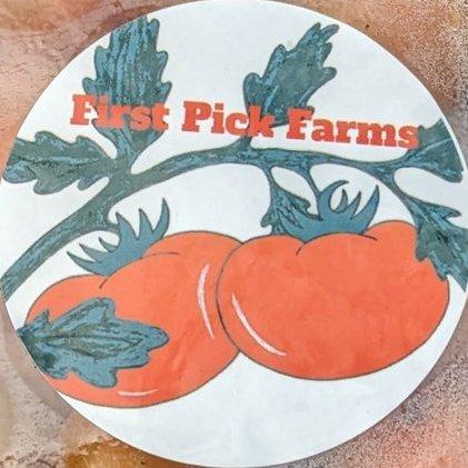 First Picks Farms logo has hand drawn red tomatoes on a green vine with their farm name in red lettering along the stem.
