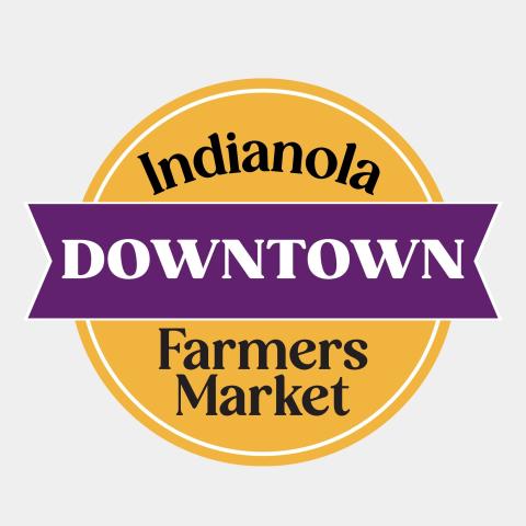 Indianola Downtown Farmers Market logo has a gold circle in the background and a purple ribbon through the middle.