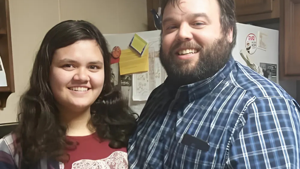 Owners Shaun and Myla Brown smiling in the kitchen.