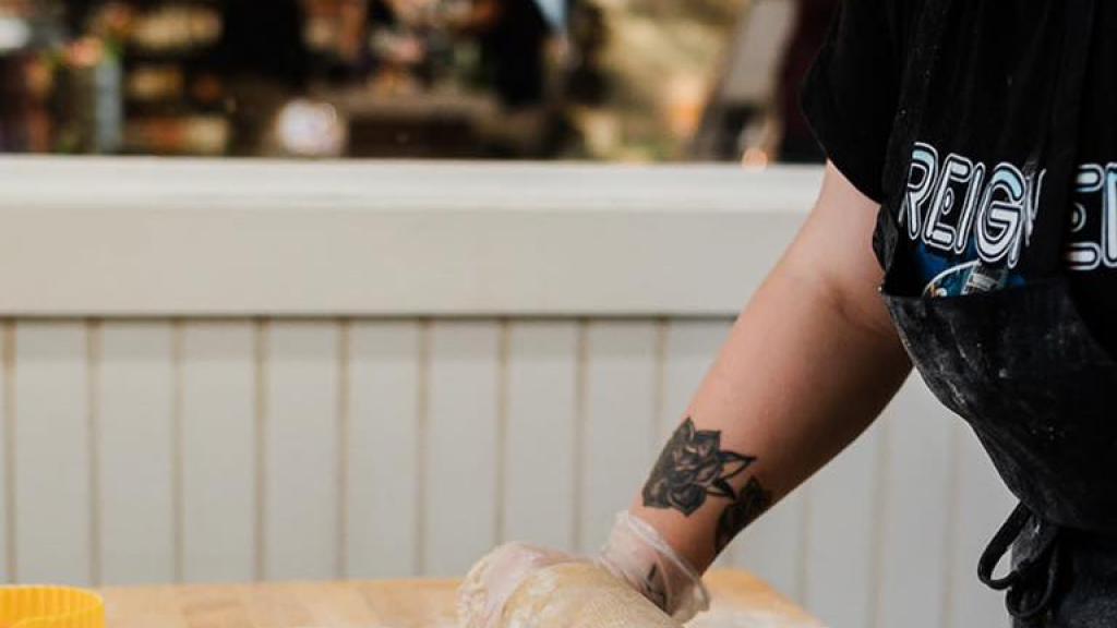 Filling Station bakery rolling out dough