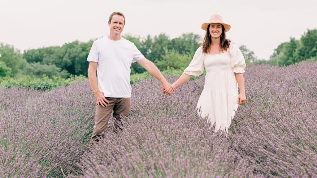 Adam and Jenn O'Neal Owners of PepperHarrow Flower Farm in a Field of Blooming Lavender