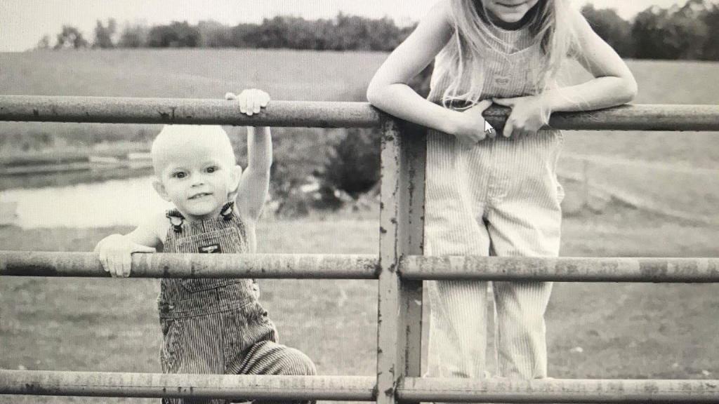 Kids on a farm gate
