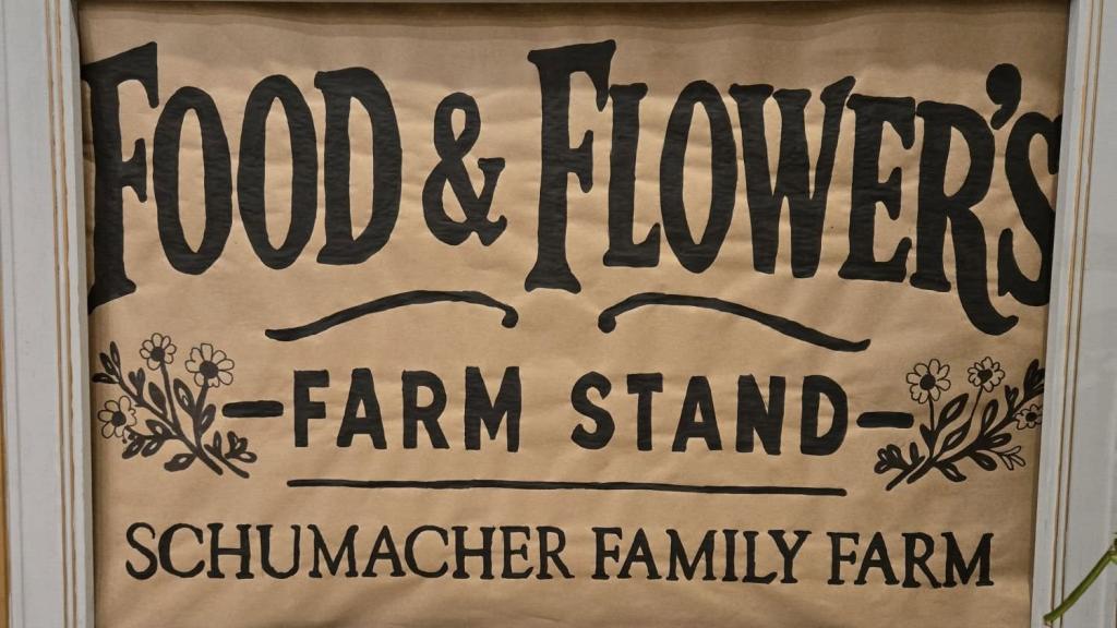 handwritten sign for Food & Flowers Farm Stand at Schumacher Family Farm