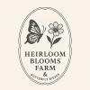 Heirloom Blooms Farm logo has a butterfly and a flower below the farm name inside an upright oval outline. 
